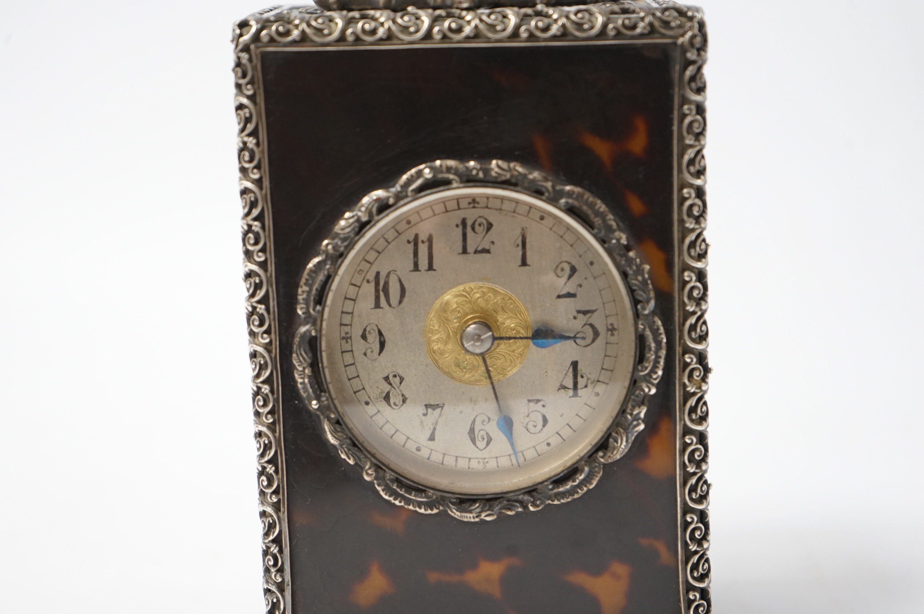 A late 19th century French tortoiseshell carriage clock, with white metal mounts, 15cm high. Condition - good, untested but currently ticking